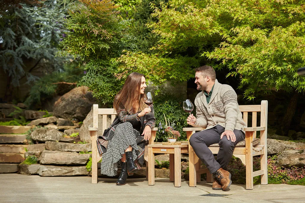Couple enjoying an outdoor tasting at Dusky Goose in Dundee Hills North